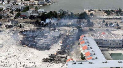 This aerial photo shows a fire in the wake of Superstorm Sandy in the central Jersey Shore on Wednesday, Oct. 31, 2012, in New Jersey. (AP Photo/Mike Groll)
